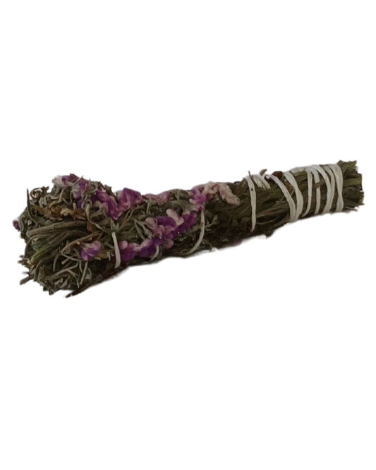 Handcrafted aromatic botanical bundle featuring dried lavender, lemongrass, and wild herbs, tied with purple twine and displayed on a white background for spiritual or decorative use