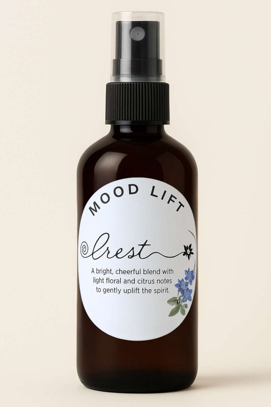 Amber glass spray bottle of Crest Mood Lift Spritz with botanical label – natural mist to uplift mood, energy, and positivity.