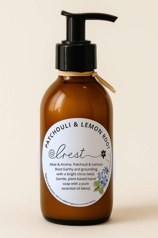 Amber pump bottle of Crest Patchouli & Lemon Root organic liquid hand soap with Aloe Vera and pure essential oils, earthy and citrus-infused plant-based blend.