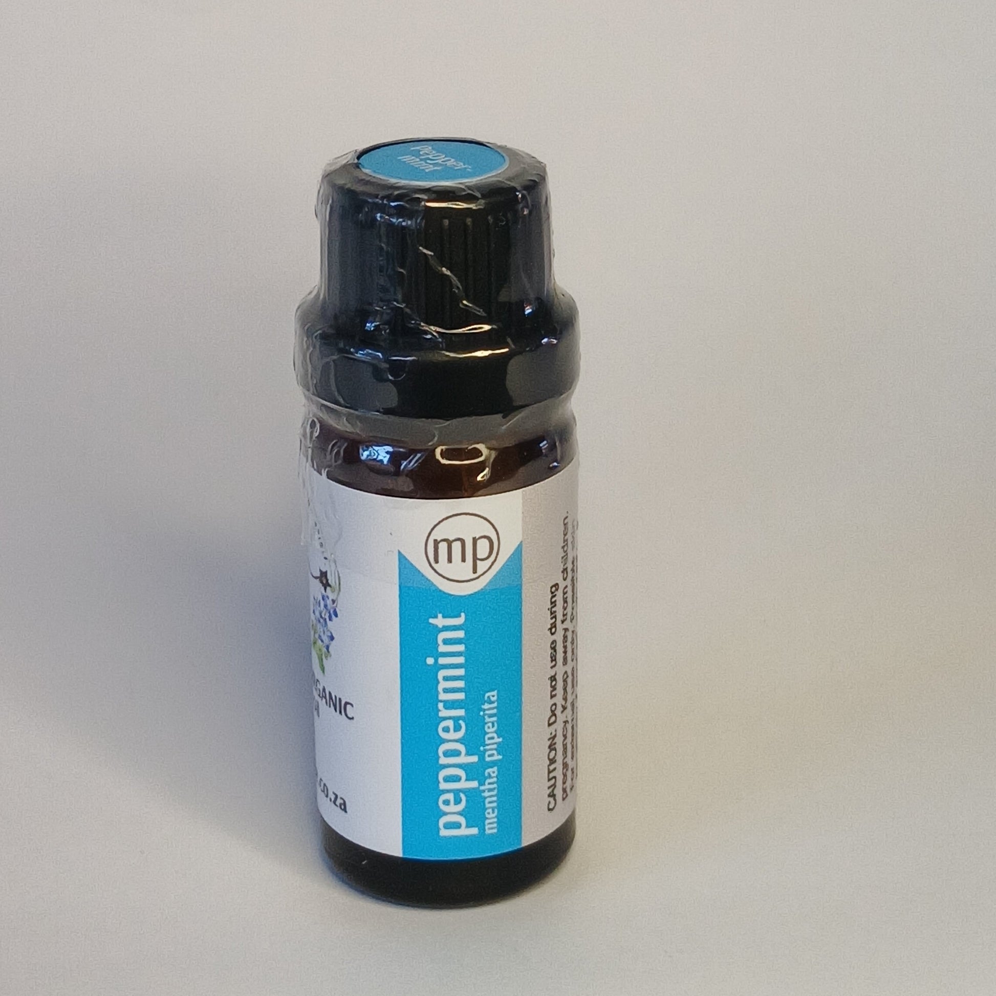 Peppermint essential oil bottle by Crest for cooling aromatherapy, focus rituals and refreshing body care blends
