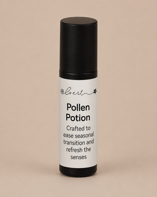 Black stainless steel roll-on applicator with Pollen Potion essential oil blend for seasonal support and refreshing the senses