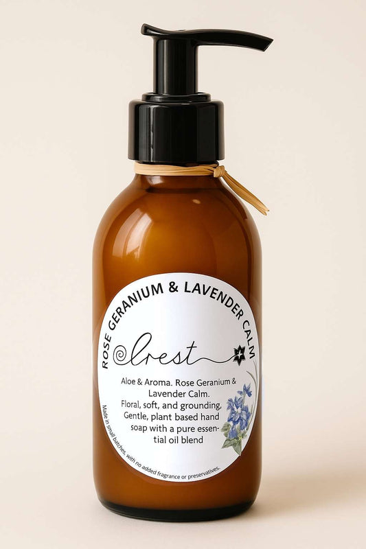 Amber pump bottle of Crest Rose Geranium & Lavender Calm organic liquid hand soap with aloe vera and pure essential oils, gentle floral and grounding blend.