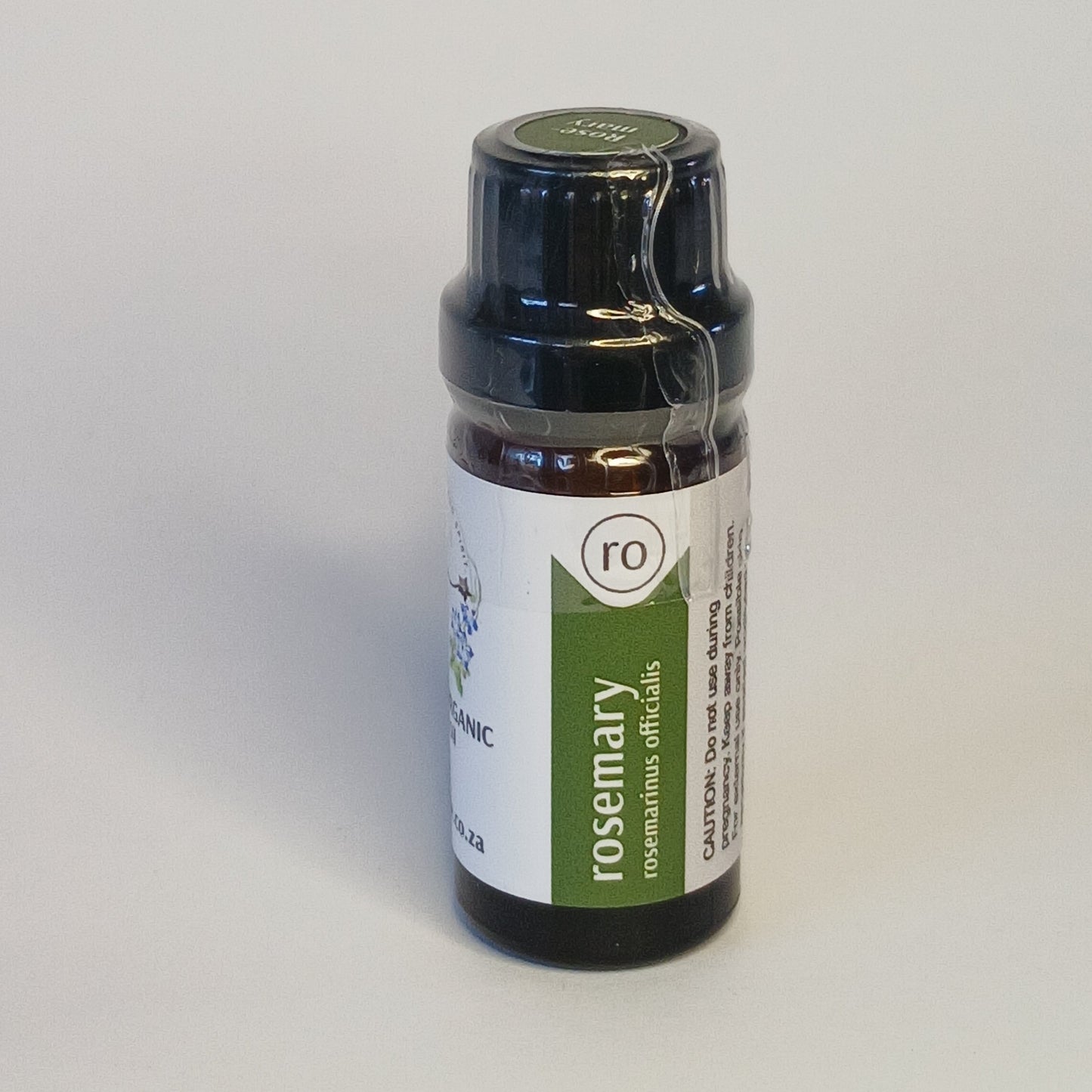 Rosemary essential oil bottle by Crest for herbal aromatherapy, focus rituals and botanical haircare blends