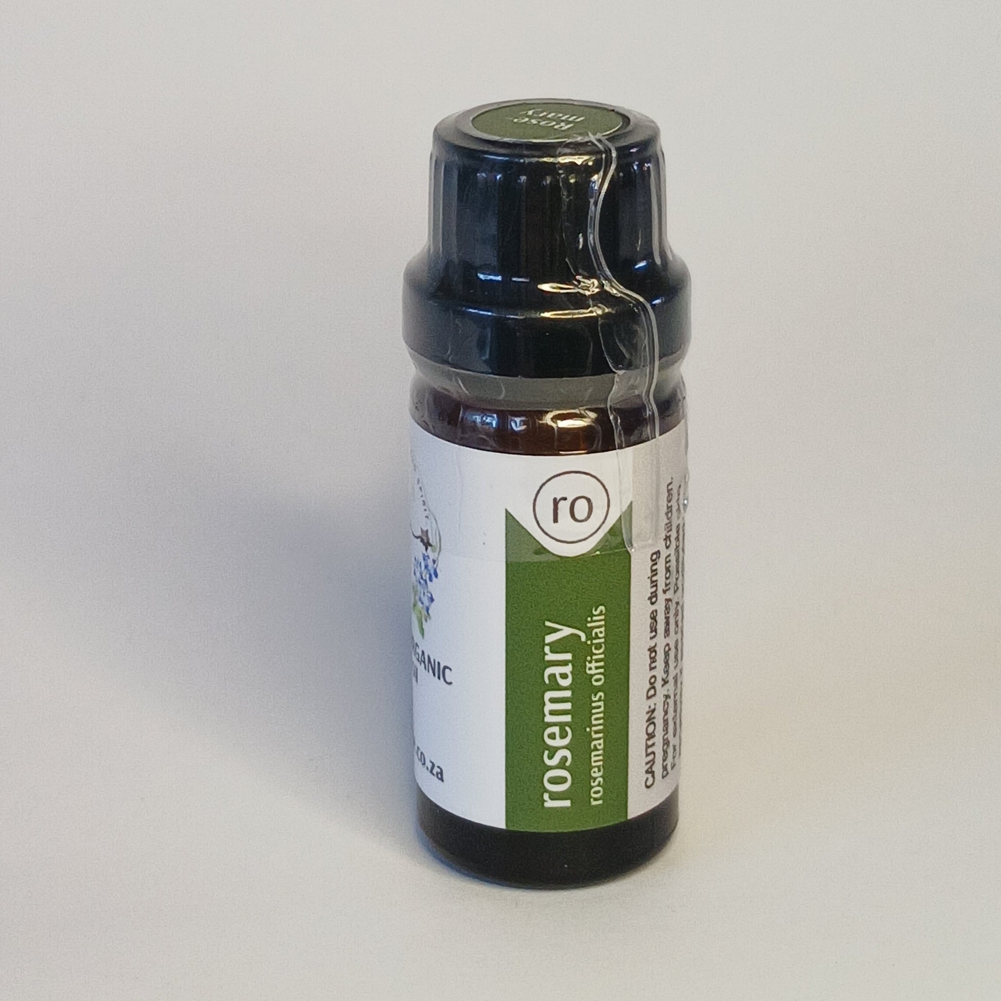 Rosemary essential oil bottle by Crest for herbal aromatherapy, focus rituals and botanical haircare blends