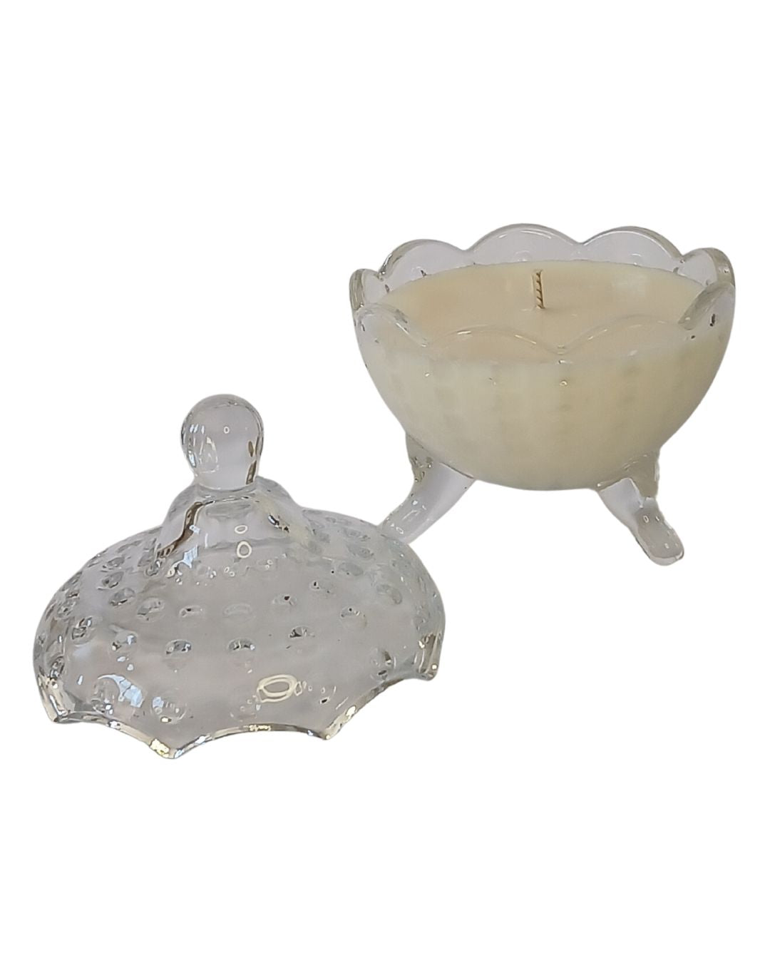 Hand-poured soy massage candle in a decorative container, infused with essential oils from the Crestlife aromatherapy collection. Designed for mood support, skin nourishment, and emotional well-being.